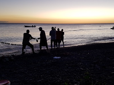 Fishermen in Saint Pierre bringing in their nets at the end of the day.