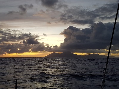The silhouette of the island of Montserrat, where in 1997 the volcano destroyed two thirds of the island. During our night sail to Saint-Martin / Sint-Maarten.